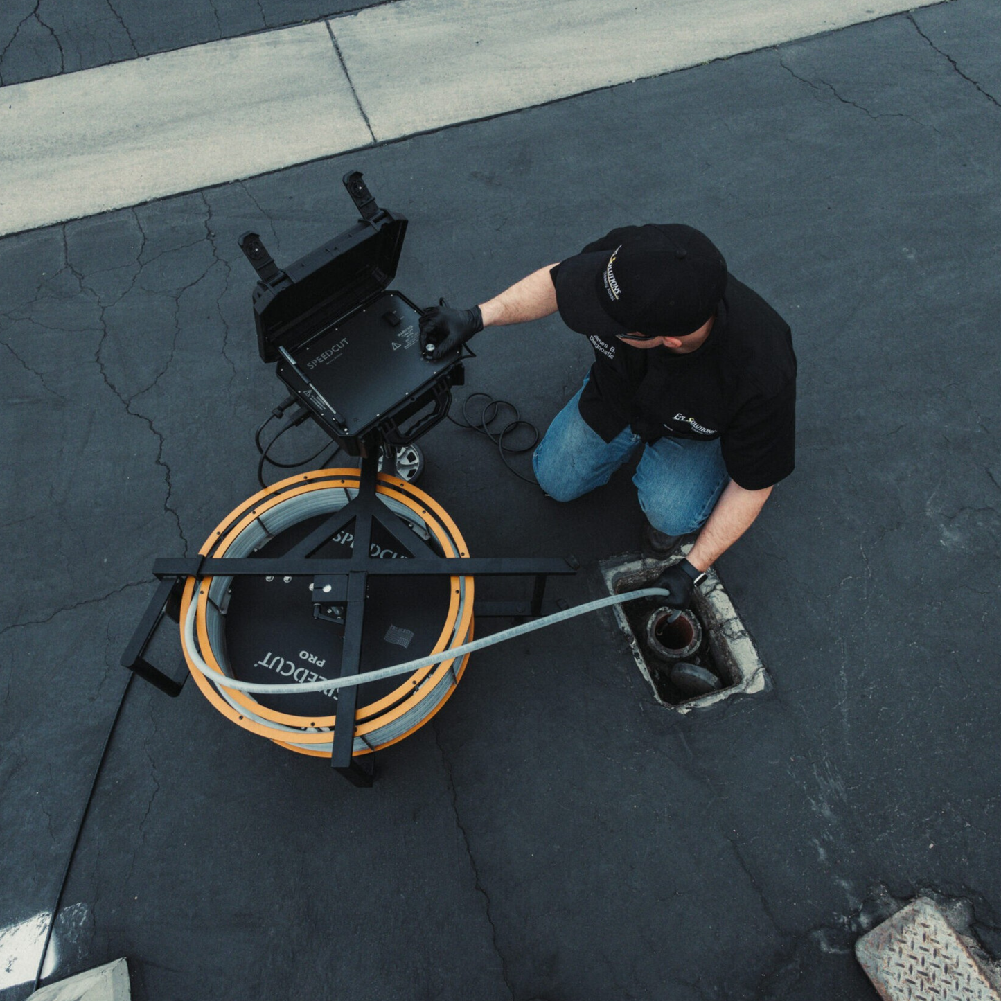 SpeedCut Pro Flex Shaft Being Used Outside in a Drain