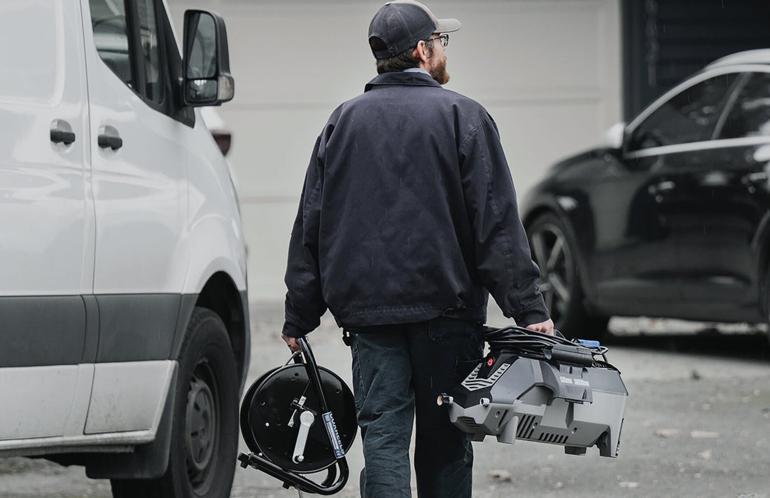 Plumbing Hero Carrying the X 2300 PSI Lightweight Jetter