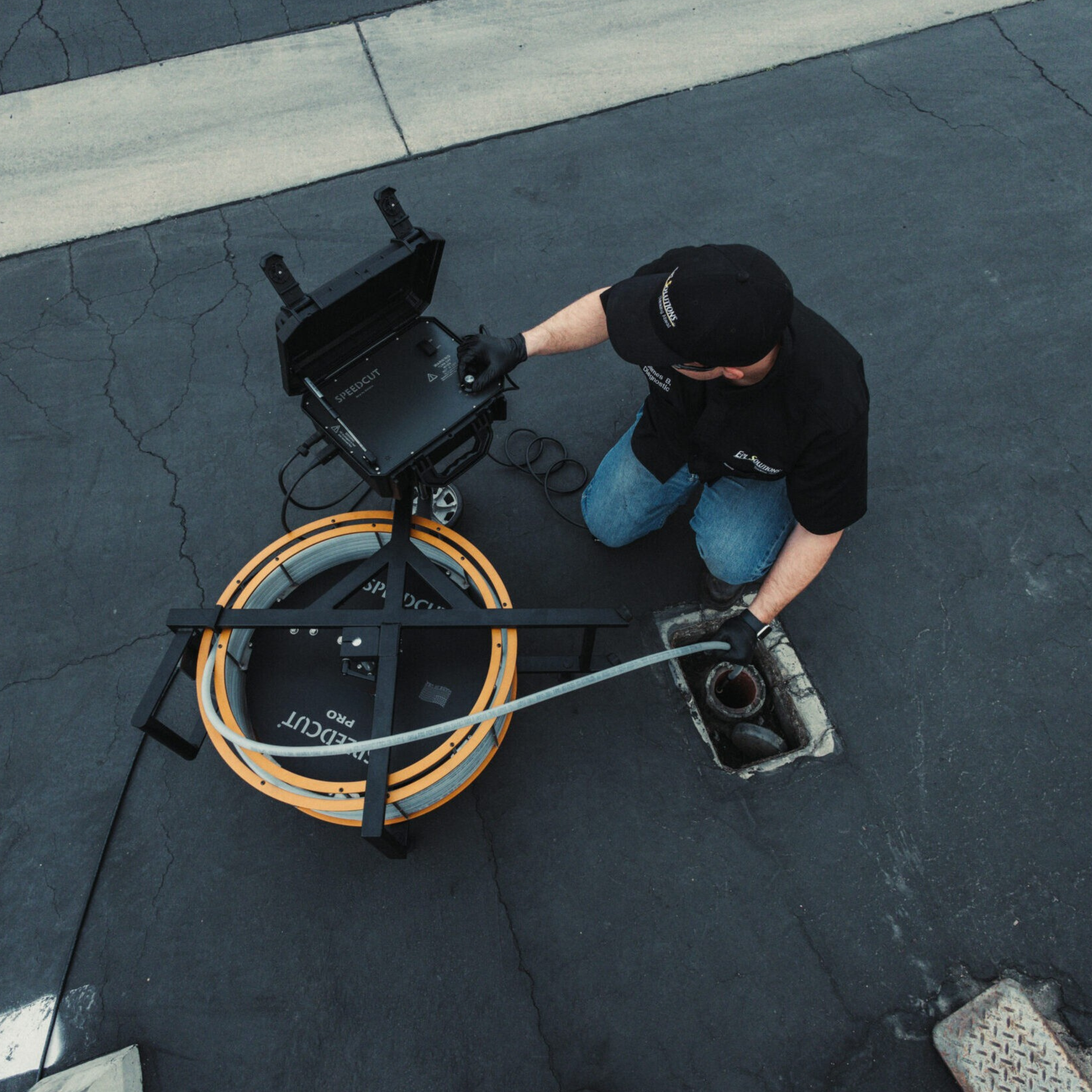 SpeedCut Pro Flex Shaft Being Used Outside in a Drain